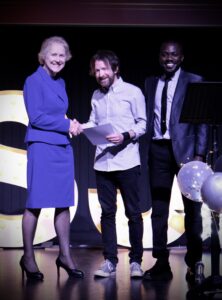 Vice Chancellor Karen Bryan and Student Union President Kamil Lawal present Course Lead Chris Johnson with the Careers Champion Award